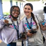 She Builds participants at the summer camp manipulating 2 small drones